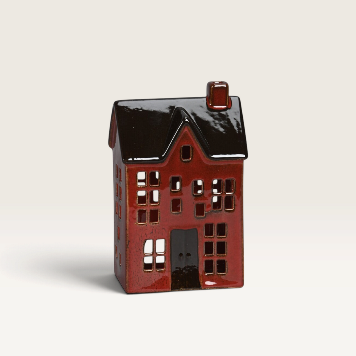 Vintage Industrial red porcelain house ornament with a dark brown roof and rustic artisanal finish.