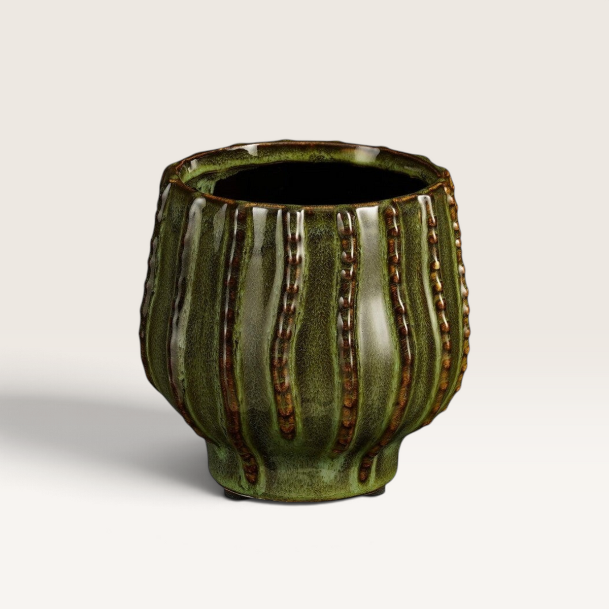 Vintage Industrial Cathy ceramic vase in a textured green finish with a rounded cylindrical shape.