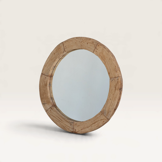 Vintage Industrial Devi round wall mirror with a rustic reclaimed wood wheel frame and natural aged patina finish.