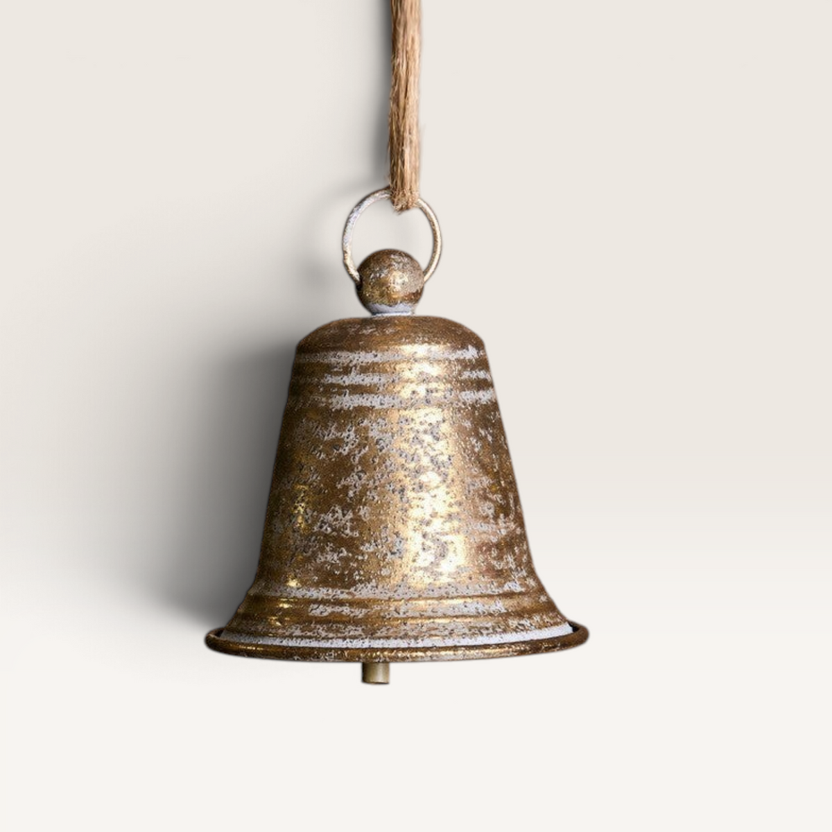 Vintage Industrial hanging bell ornament in aged gold finish with rustic texture and jute rope hanger.