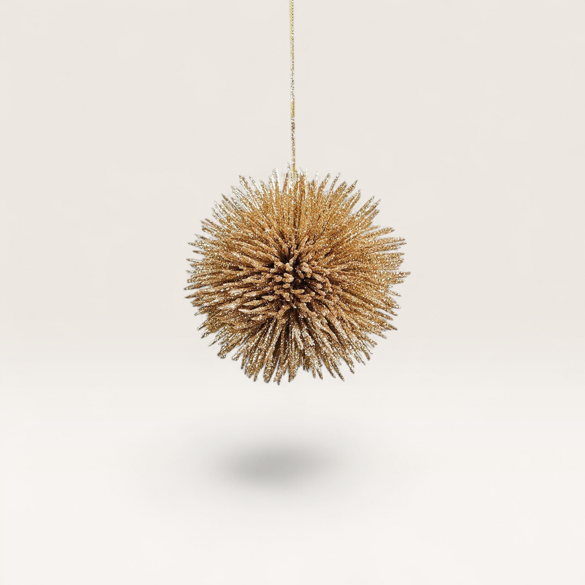 Vintage Industrial Colgante Pino ornament in aged gold finish with a spiky, spherical design for elegant decor.