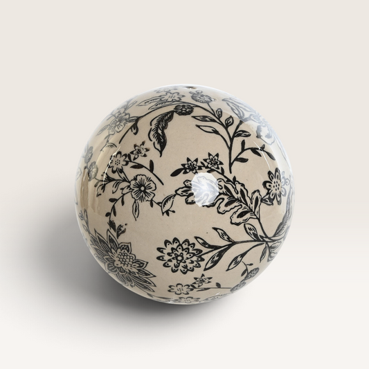 Vintage Industrial Zaria decorative stoneware ball featuring a cream base with intricate black floral patterns.