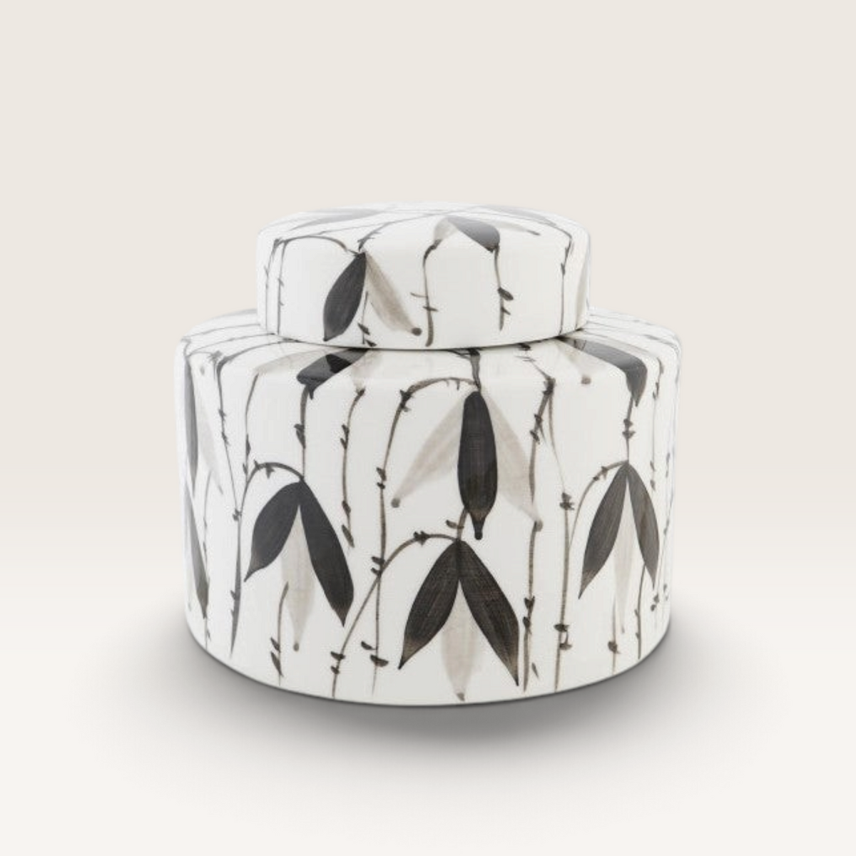 Vintage Industrial Tibor Fayún porcelain jar with hand-painted black and grey bamboo leaf motifs on white background