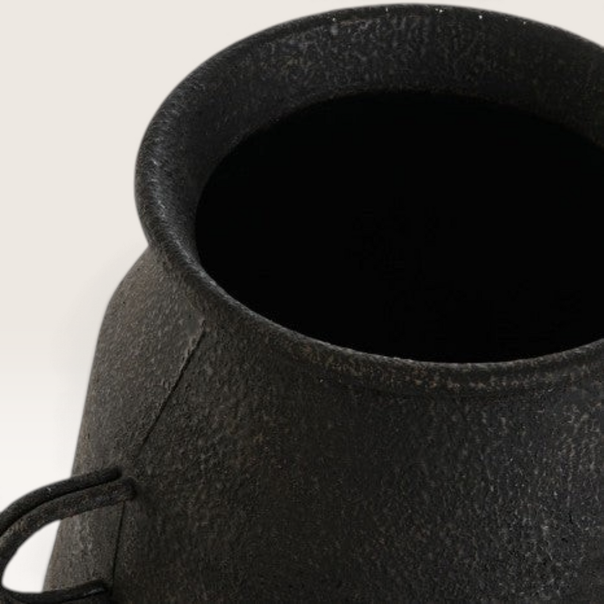 Vintage Industrial Ambon vase in matte black metal with a textured finish and a small handle detail.