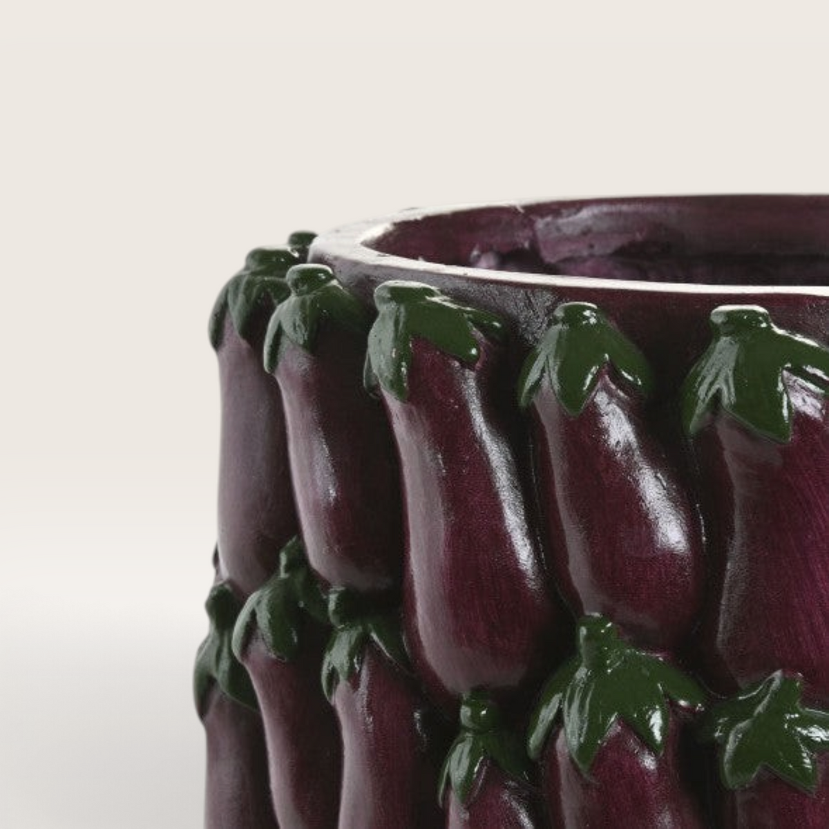 Vintage Industrial Tum vase in deep eggplant purple magnesia with a textured relief pattern of small eggplants.