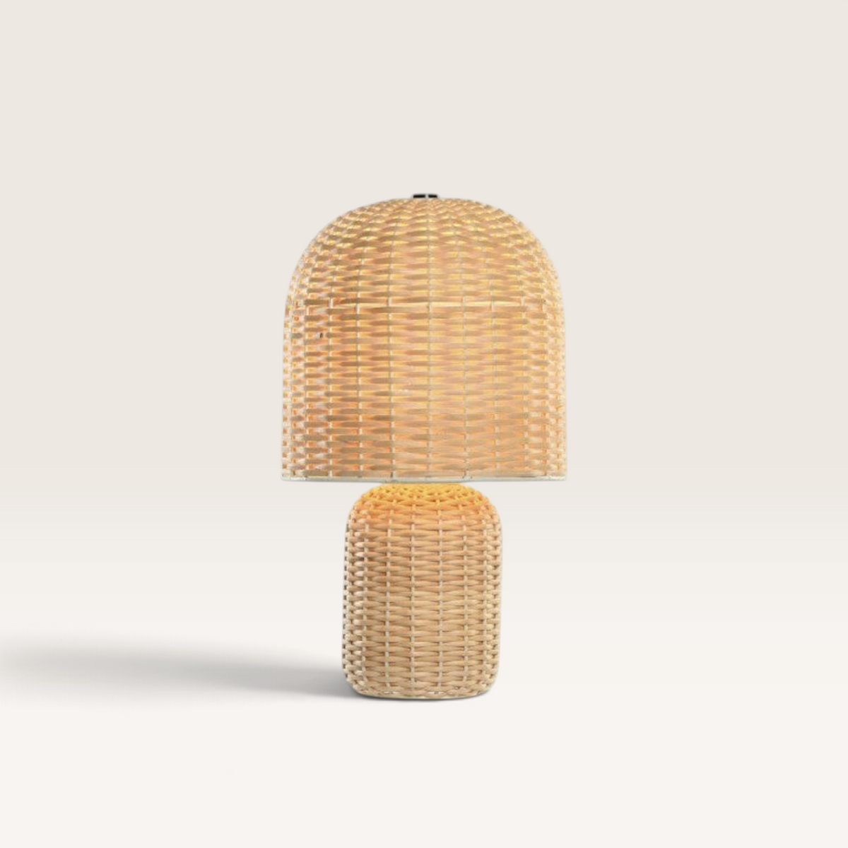 Vintage Industrial Kamar table lamp made of natural beige rattan with a woven dome shade and cylindrical base.
