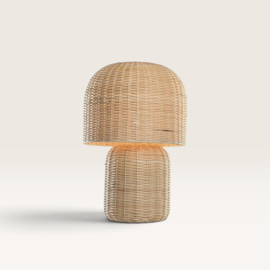 Vintage Industrial Kamar table lamp made of natural beige rattan with a woven dome shade and cylindrical base.