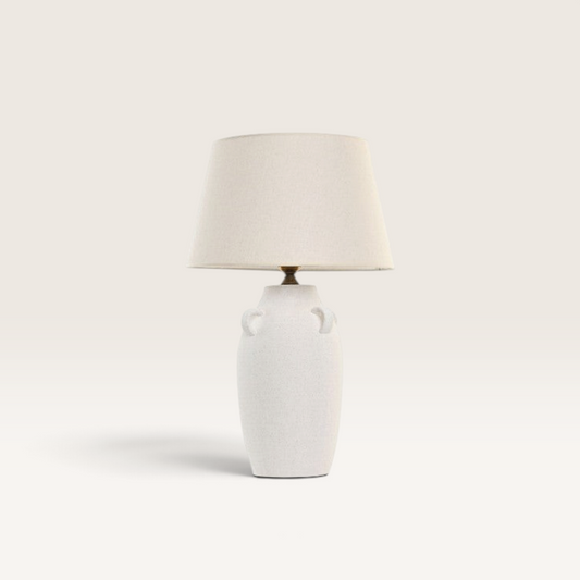 Vintage Industrial Marbu table lamp with a white porcelain base, decorative handles, and a beige linen shade.