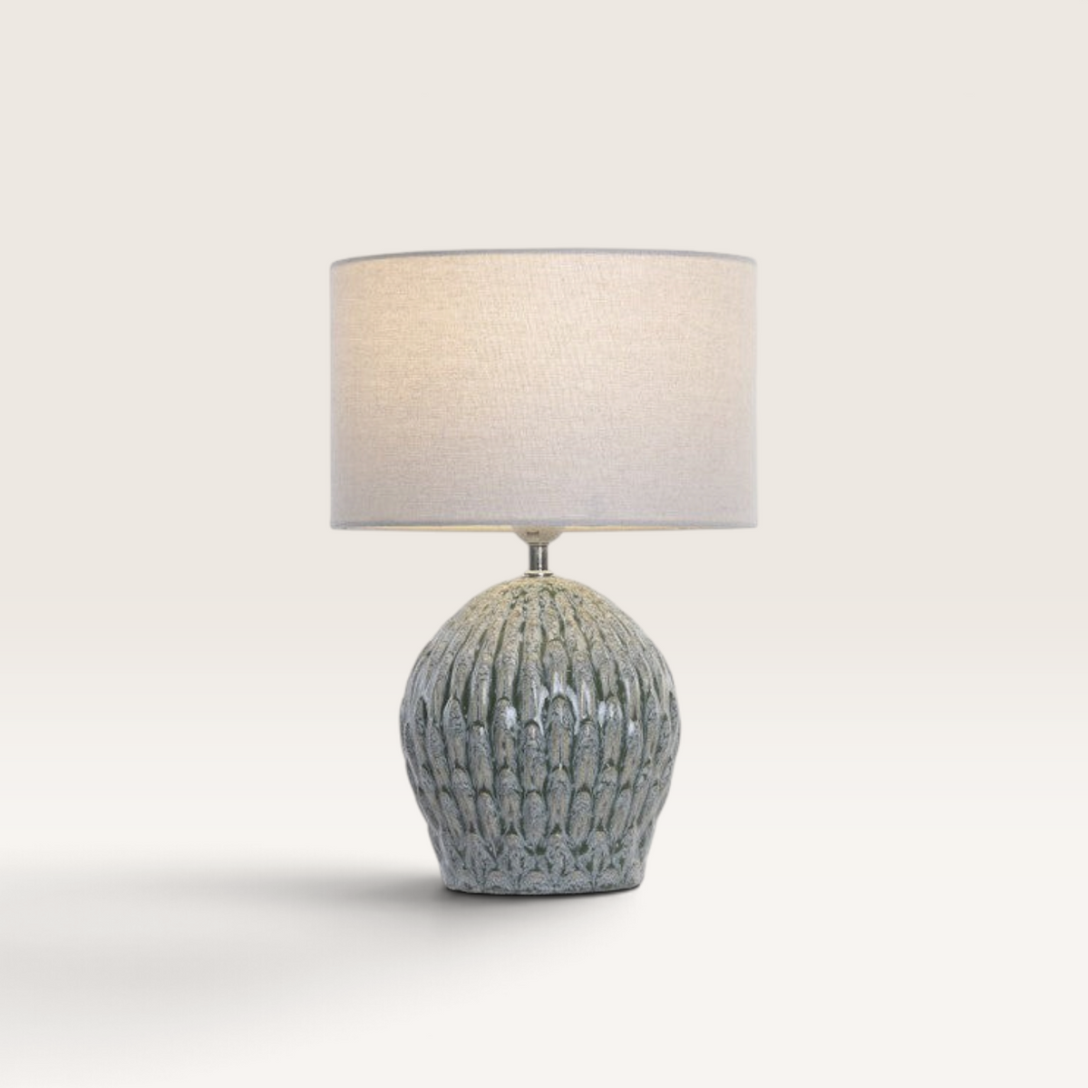 Vintage Industrial Musu table lamp with a textured turquoise dolomite base and a neutral linen drum shade.