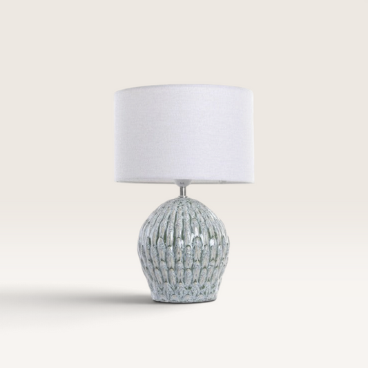 Vintage Industrial Musu table lamp with a turquoise dolomite base and a white linen drum shade.