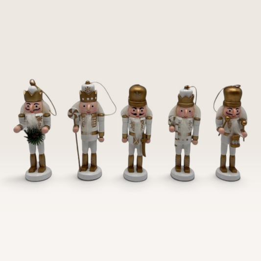 Vintage Industrial set of five white and gold MDF nutcracker hanging ornaments with festive details