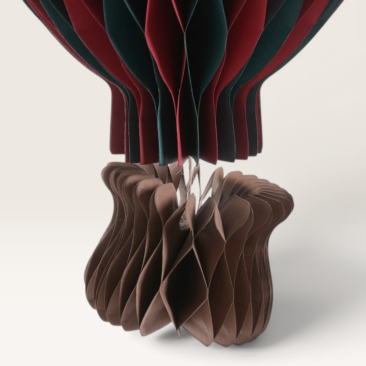 Vintage Industrial hanging hot air balloon paper decoration in red, green, and brown for festive home decor
