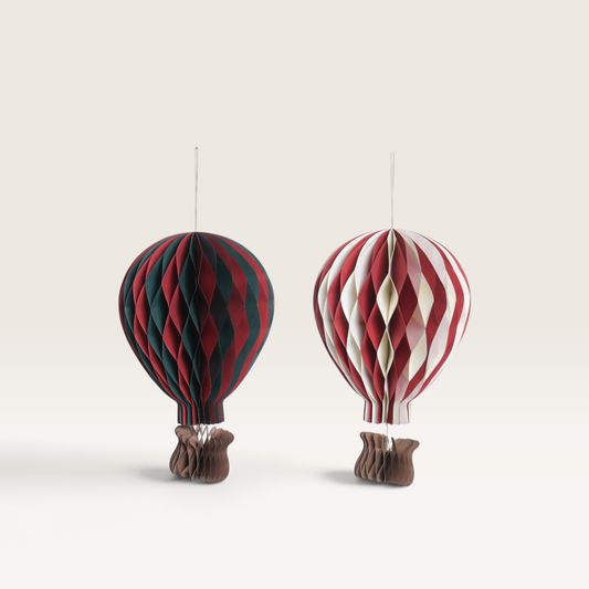 Vintage Industrial Figura Poso hanging paper hot air balloon decorations in red, green, and cream festive colors.