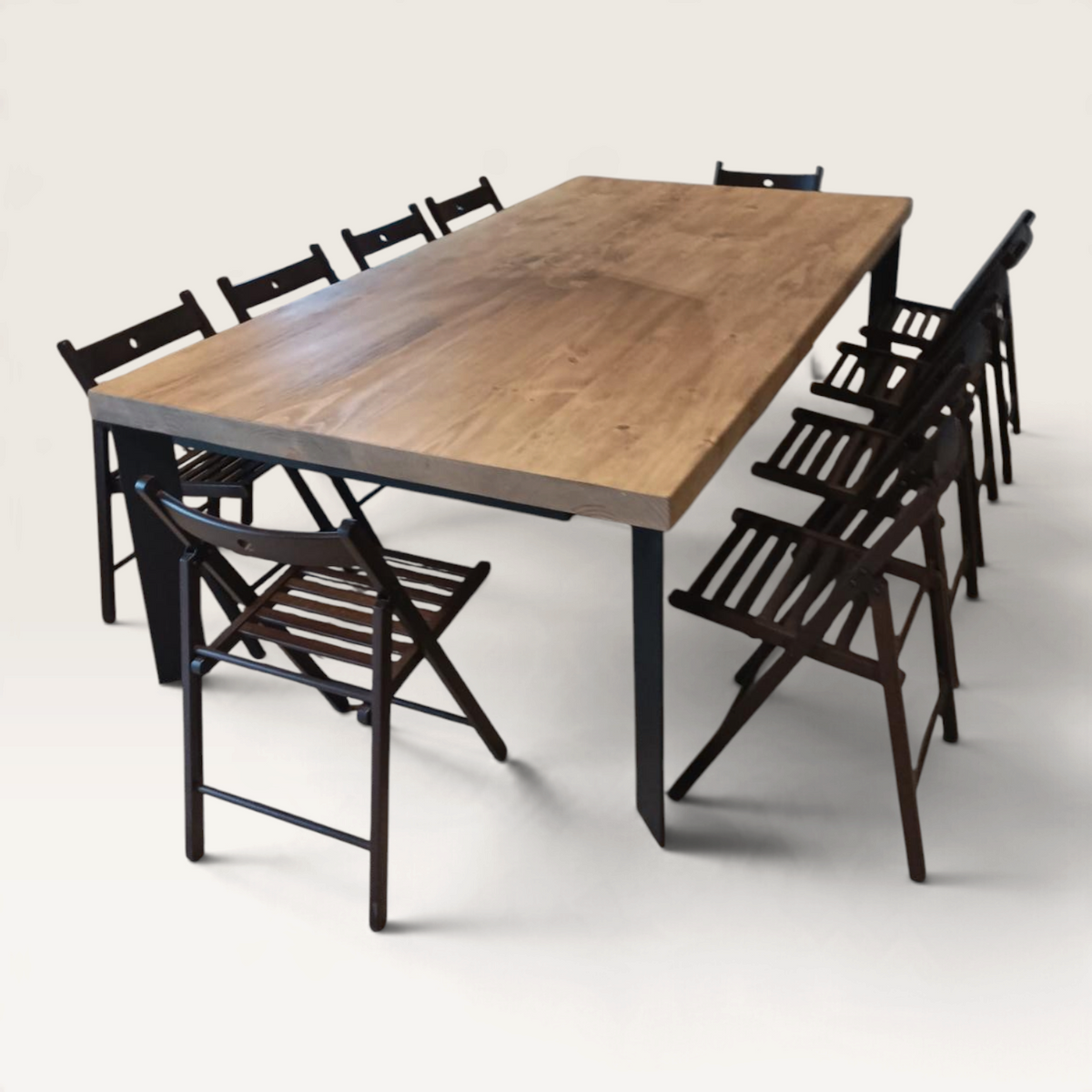 Vintage Industrial Kalumi dining table with sand-finished solid pine top and black iron legs in a modern home.