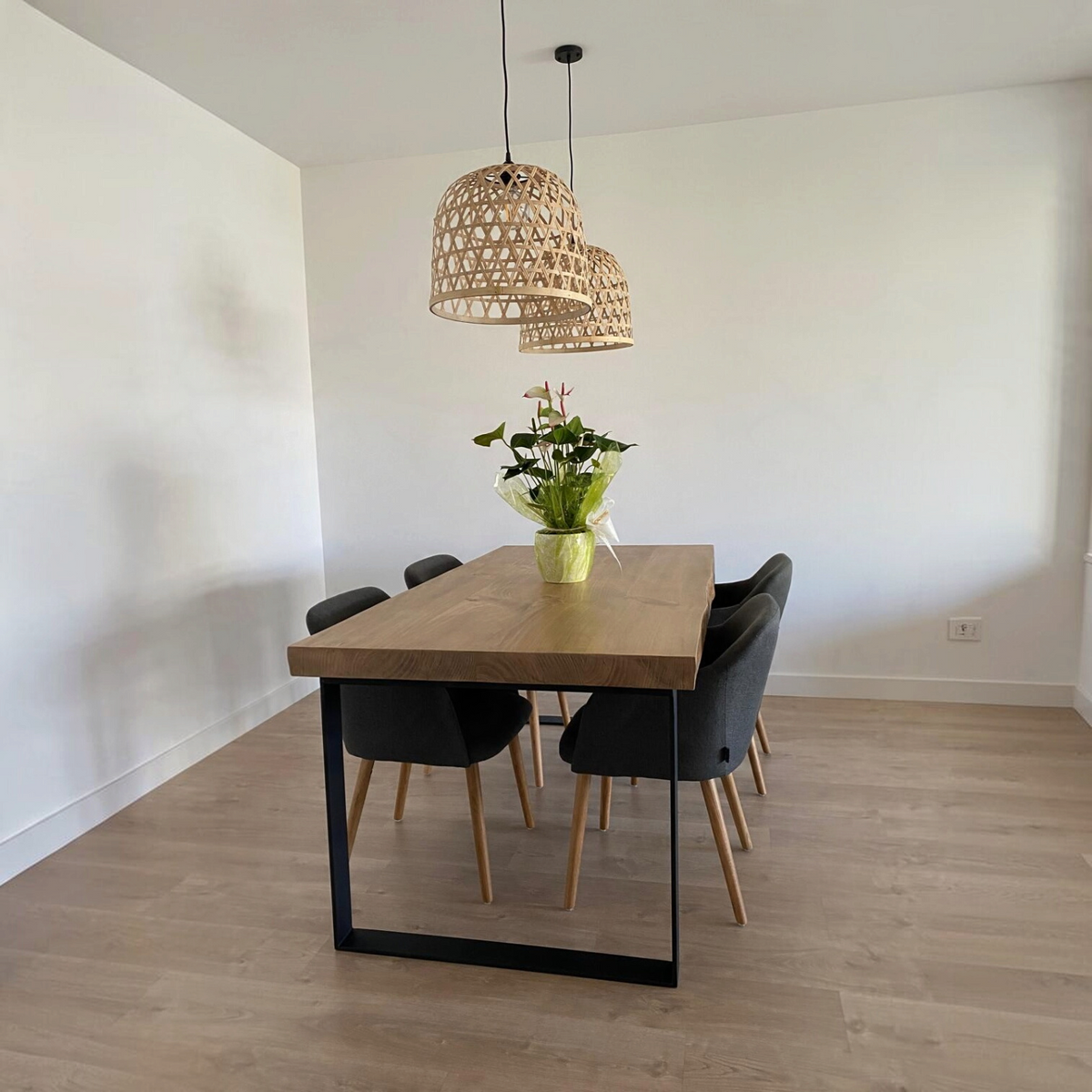 Vintage Industrial Sut dining table with honey-finished solid pine wood top and black iron frame in a modern room
