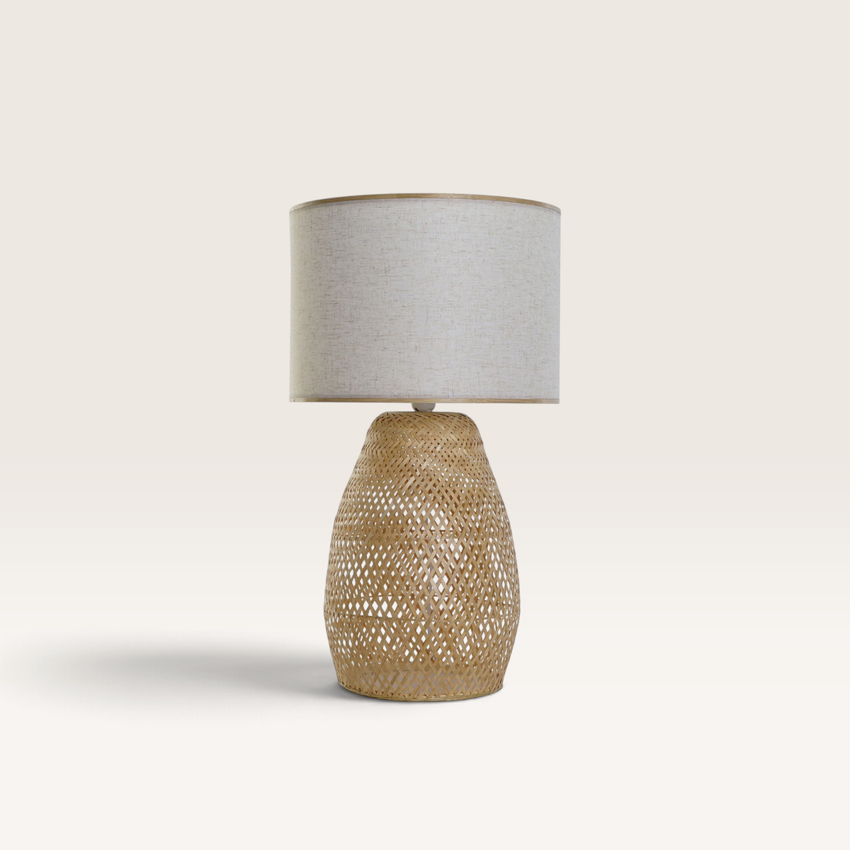 Vintage Industrial table lamp with a woven bamboo base and a natural polyester fabric drum shade