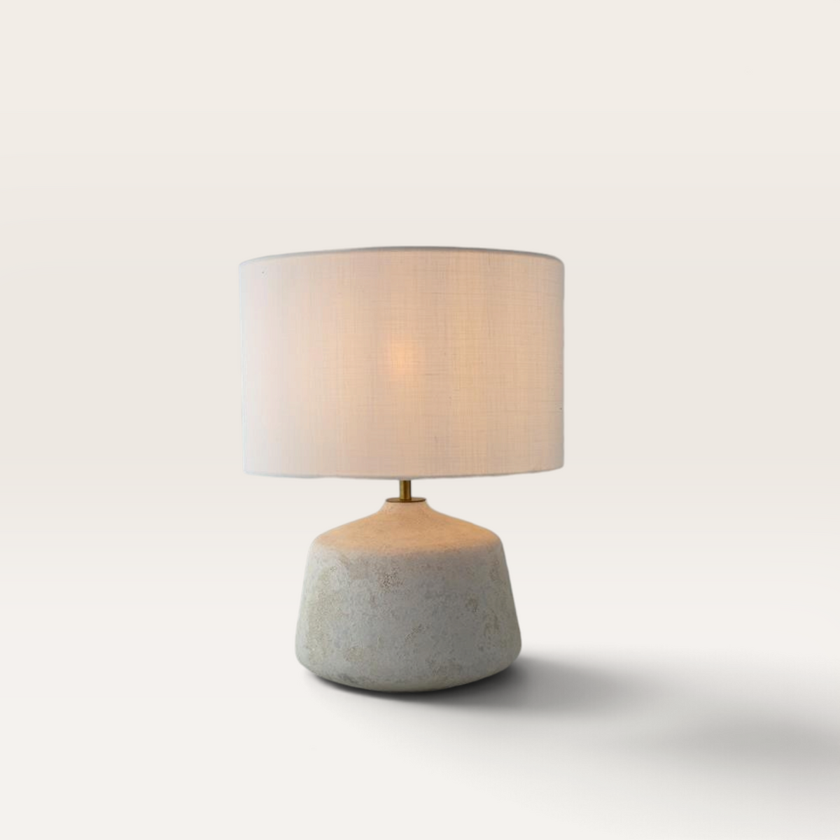 Vintage Industrial Medan table lamp with a matte white ceramic base and an off-white linen drum shade.