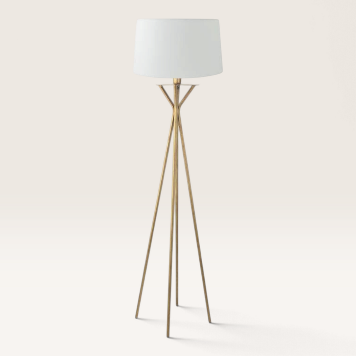 Vintage Industrial Diane floor lamp with a gold tripod base and a white drum shade for warm ambient lighting