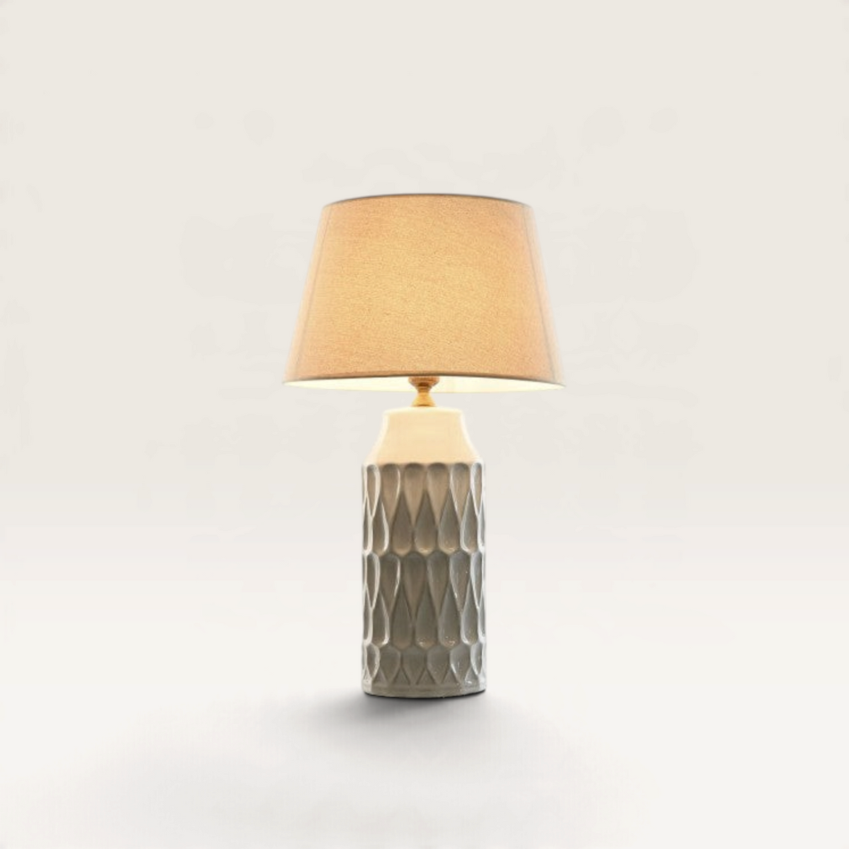 Vintage Industrial Betung table lamp with a textured grey porcelain base and a warm beige cotton lampshade.