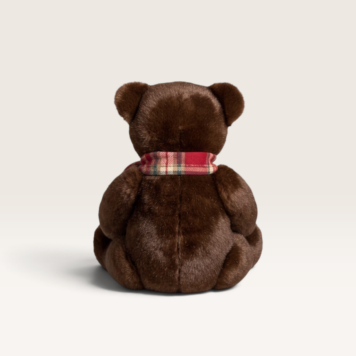 Vintage Industrial brown plush teddy bear figurine with a festive red plaid scarf, back view.