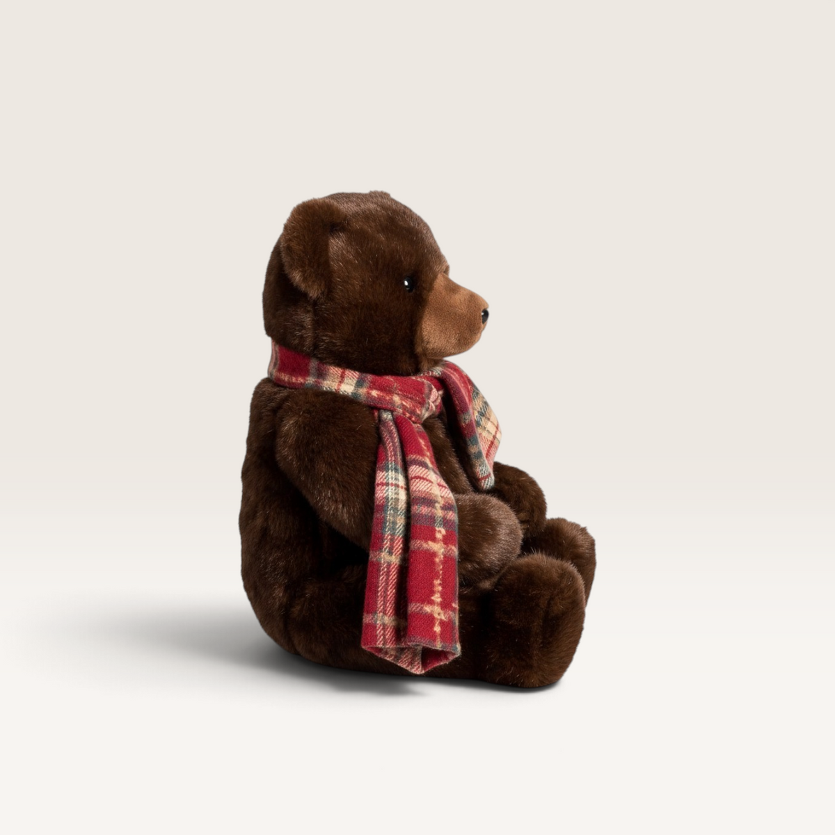 Vintage Industrial brown plush teddy bear figurine wearing a festive red and green plaid scarf for Christmas decor.