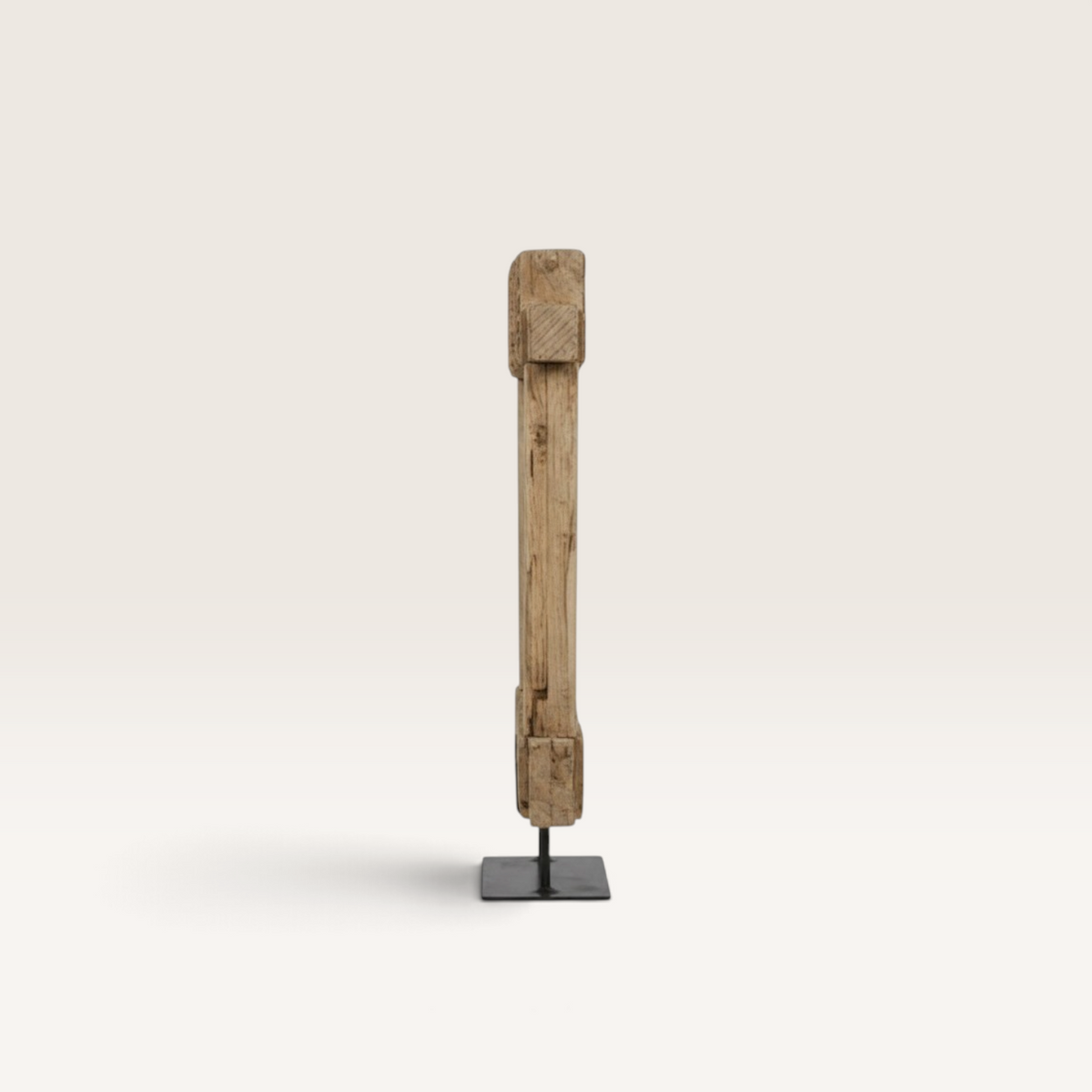 Vintage Industrial natural teak wood sculpture on a black metal stand, side view of a unique artisan decor piece.