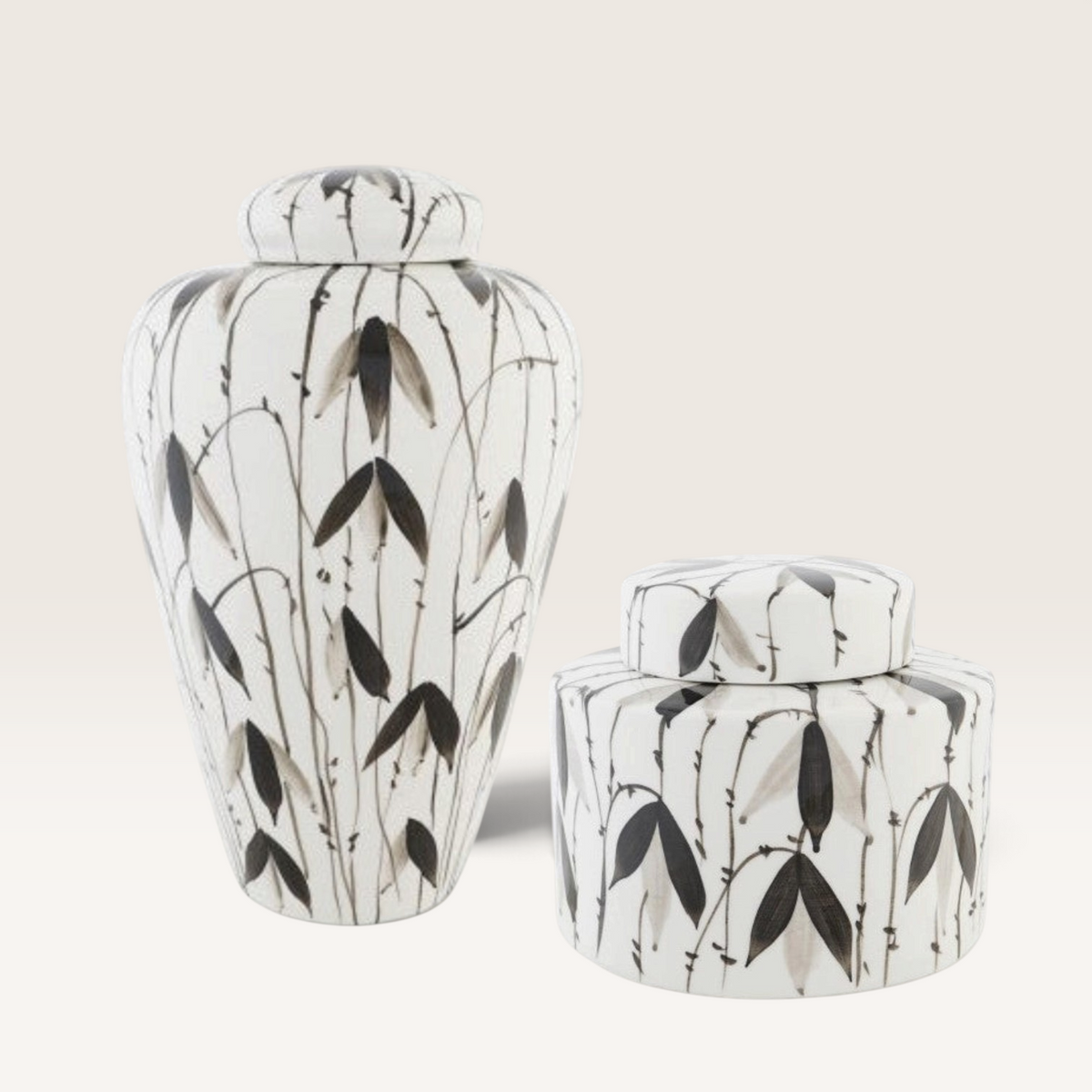 Vintage Industrial Tibor Fayún porcelain jars with hand-painted black and grey botanical leaf patterns on white.