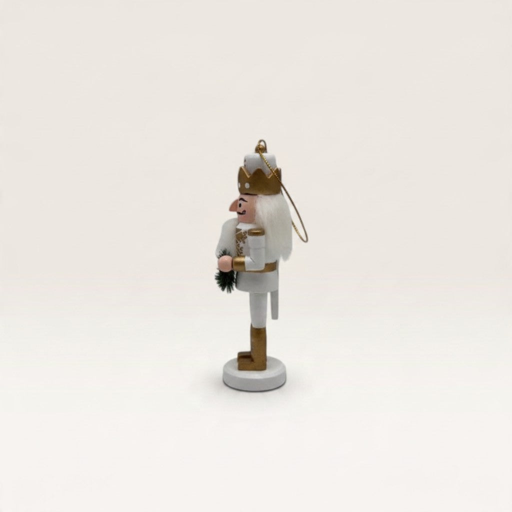 Vintage Industrial hanging nutcracker figure in white and gold MDF with a crown, side view